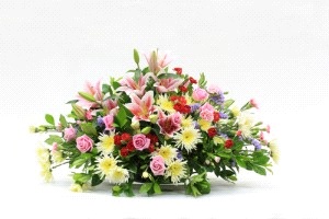 Cuscino funebre con gigli, rose e gerbere